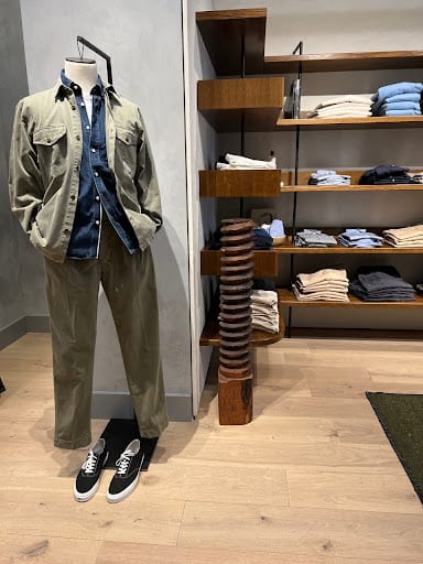 A Male Manequinn Dressed Well In A Streamlined Clothing Store