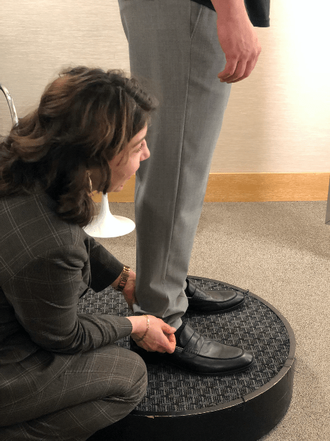 man getting pants hemmed