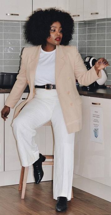 A Woman Wearing A Tailored T-Shirt Under A Natural Blazer In Casual West Coast Style For Women