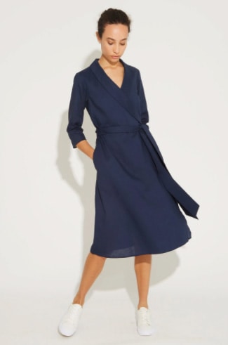 A Woman Wearing A West Coast Style No Dress Code Blue Wrap Dress