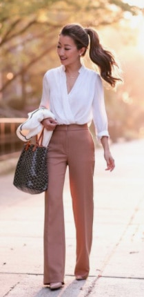 A Woman Wearing A White Lightweight Blouse With Pink Wide Leg Pants In West Coast Style