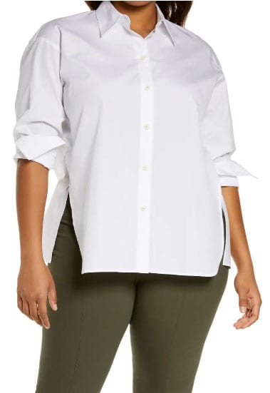 A Woman Modeling How To Build A Work Capsule Wardrobe For Summer With A Cotton Poplin Button Up Shirt By Vince