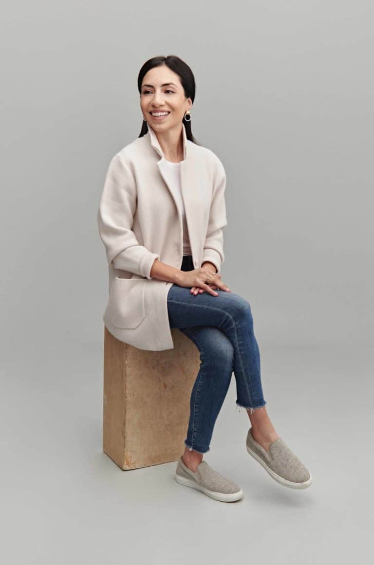 Cassandra Sethi sitting on a box looking stylish