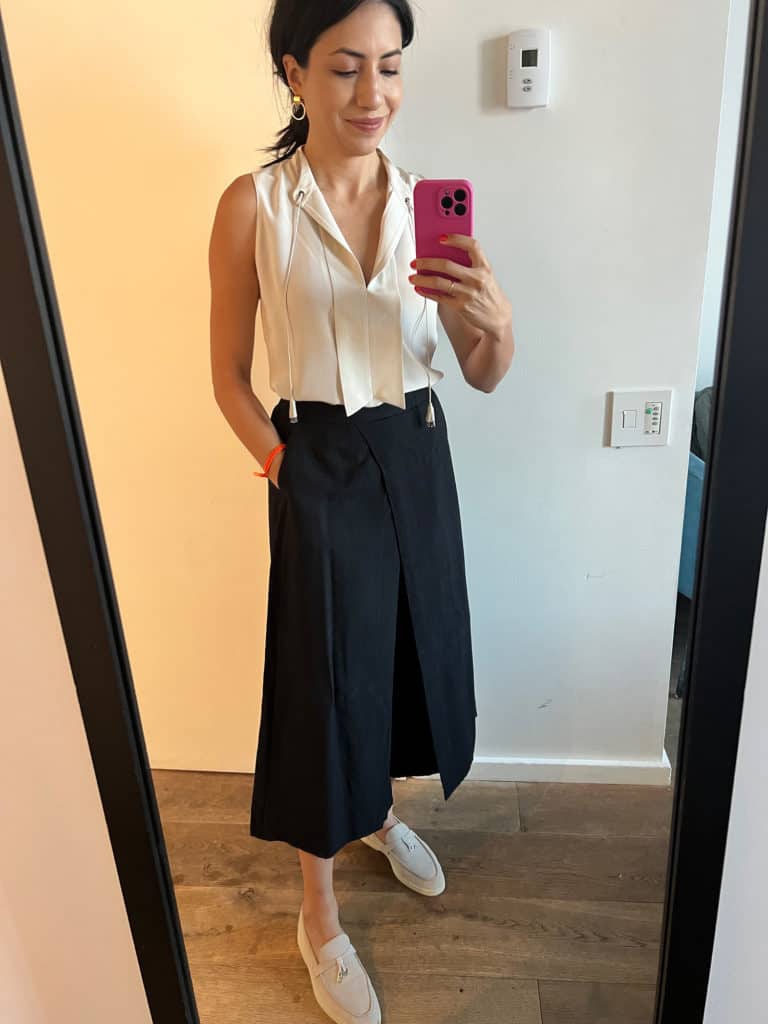 Cassandra Sethi dressed in a white silk blouse and linen pants for the NYC summer