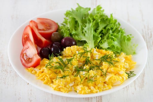 Eggs with veggies or fruit is a high-protein warm breakfast