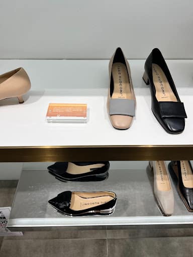 Pairs Of Neutral And Dark Flats Featured In A Tokyo Store