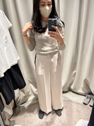 Personal Stylist Cassandra Sethi Selfie In A Tokyo Fitting Room Mirror Wearing A Mask