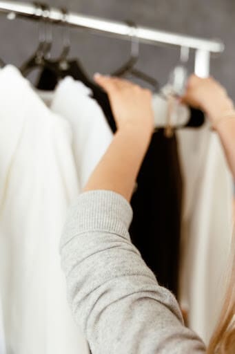 Person searching for clothes for what our most successful clients have in common 