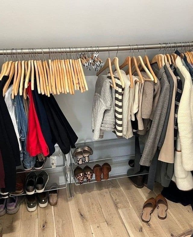 Image of a closet that has been cleaned out to display essential, versatile clothing.