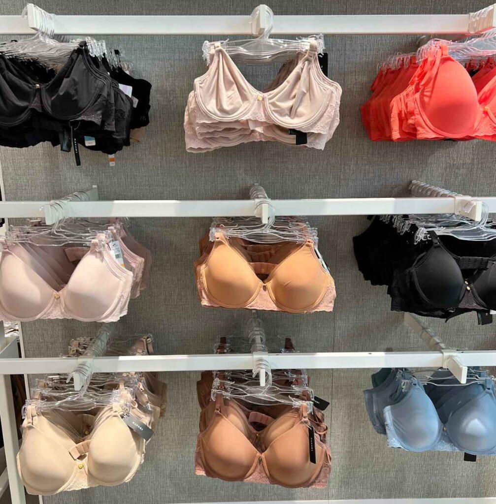A clothing store wall displaying women's undergarments.
