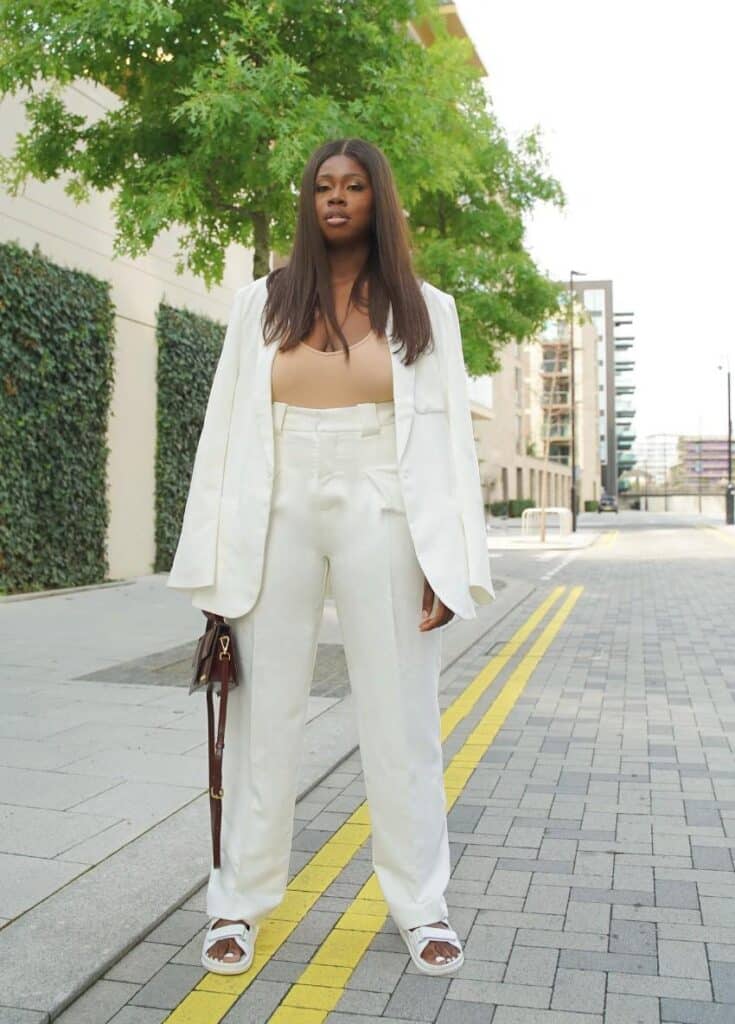 Hannah J. Lewis in a business casual monochromatic suit.