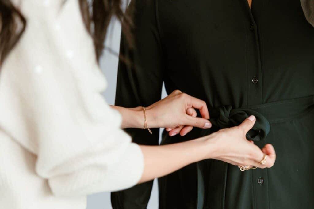 Personal stylist Cassandra Sethi styling a mid-size client in professional business casual attire.