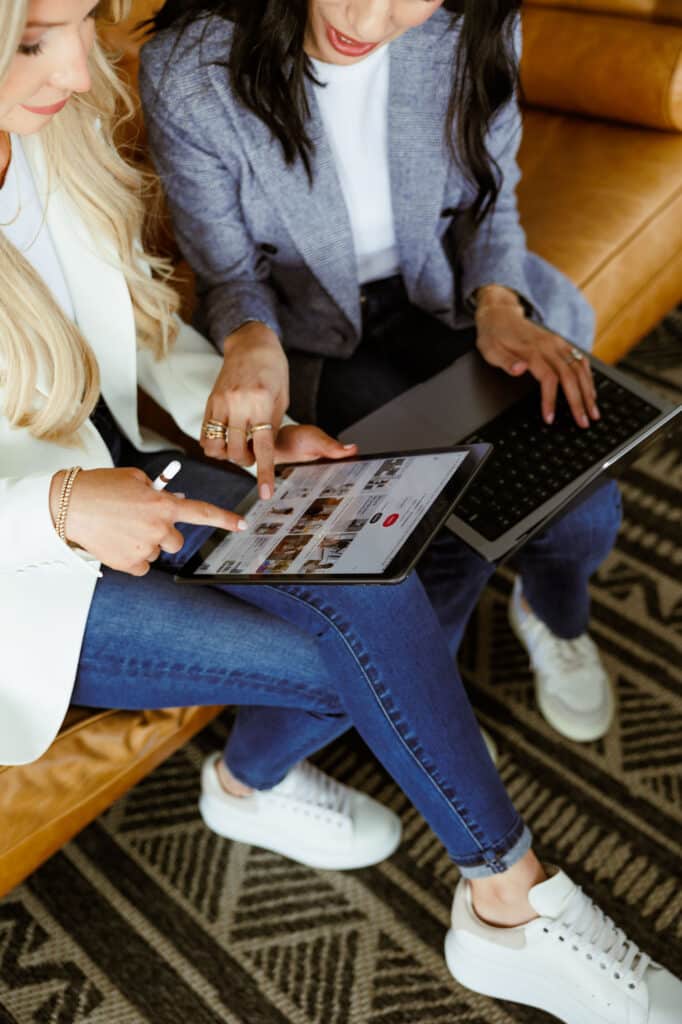 Woman skimming Pinterest to find styles she likes for her women's office workwear.