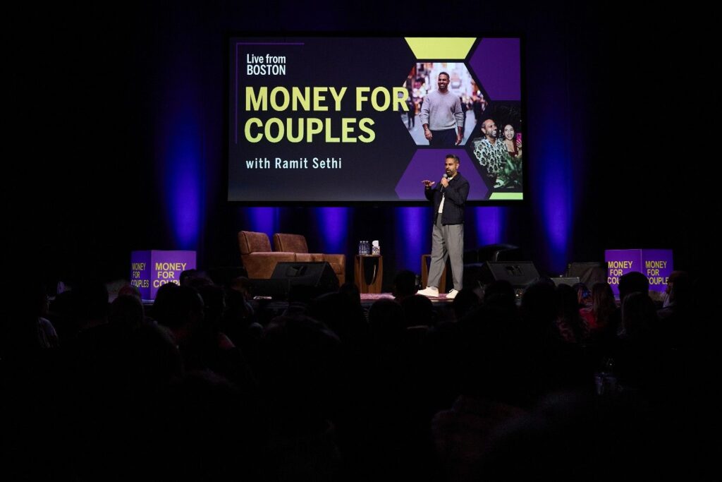 Ramit Sethis wearing gray pants, a white tee, and sneakers.