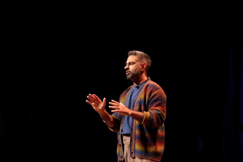 Image of Ramit Sethi in a multicolored cardigan.