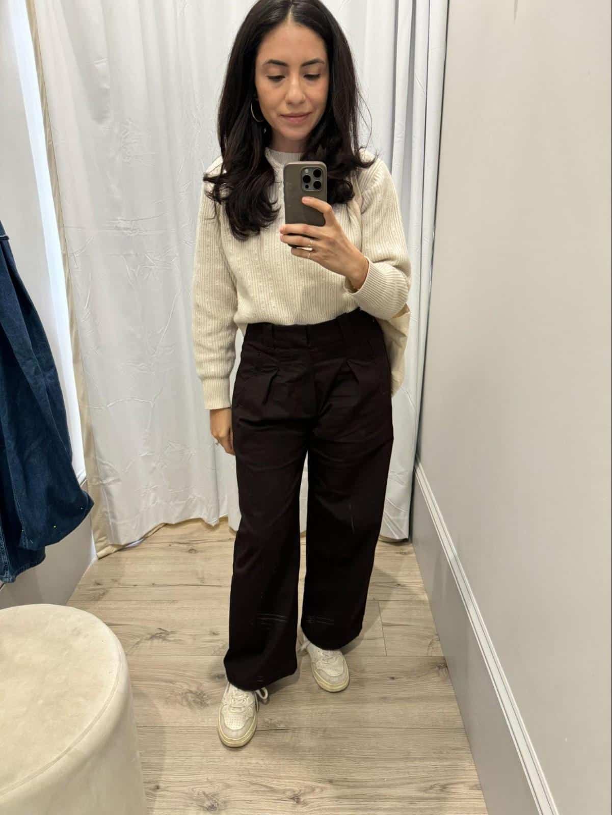 Next Level Wardrobe founder Cassandra Sethi in a classic sweater and trousers business casual look