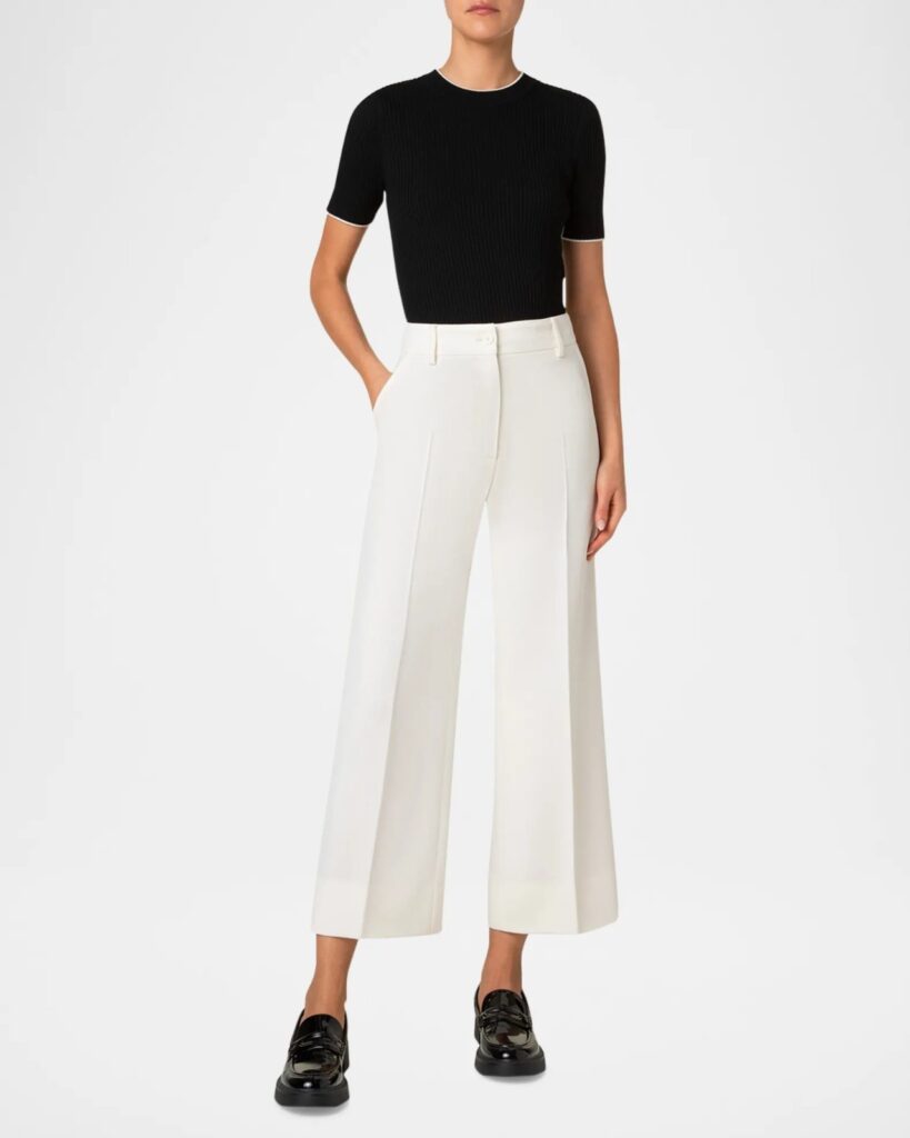 The image shows a female wearing a knit top and cropped pants for a business casual look.